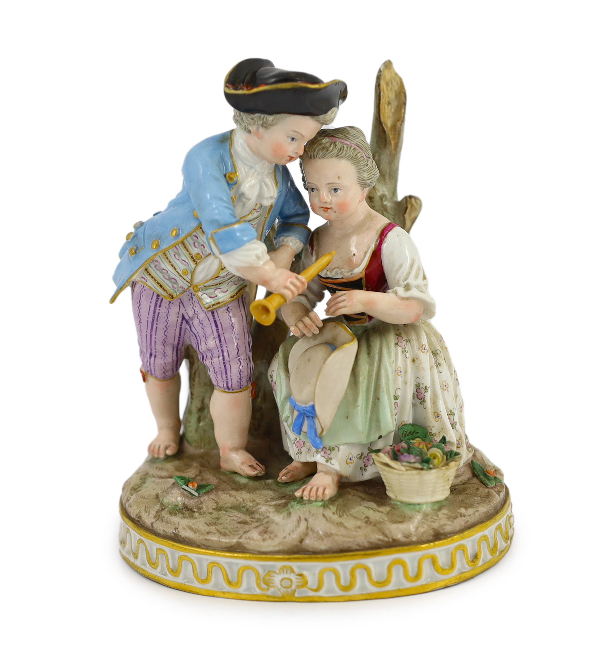 A Meissen group of a boy and a girl with a piccolo, 19th century, small losses